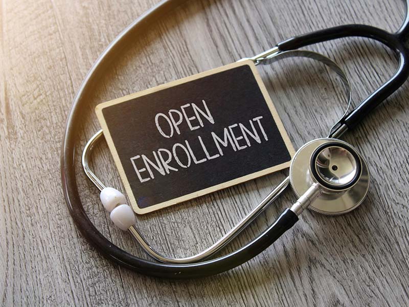 Open enrollment sign with doctor's stethoscope